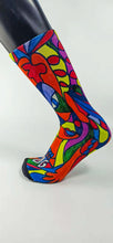 Load image into Gallery viewer, Custom Bamboo Sock with a stylistic face of a woman in green, red, blue, yellow, and orange.