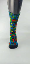 Load image into Gallery viewer, Checkered designed bamboo socks in a red, blue, green, and yellow rectangle and square mosaic.