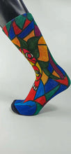 Load image into Gallery viewer, A bamboo sock with a cubist caricature of a face in teal, red, green, blue, and yellow geometric shapes