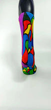 Load image into Gallery viewer, A stylistic bamboo sock with flowing whimsical designs in yellow, purple, blue, black, and red shapes.
