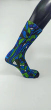 Load image into Gallery viewer, A bamboo sock with blue, green, and black intertwining shapes.