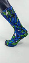 Load image into Gallery viewer, A bamboo sock with blue, green, and black intertwining shapes.