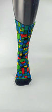 Load image into Gallery viewer, Checkered designed bamboo socks in a red, blue, green, and yellow rectangle and square mosaic.

