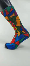 Load image into Gallery viewer, A bamboo sock with a cubist caricature of a face in teal, red, green, blue, and yellow geometric shapes

