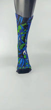 Load image into Gallery viewer, A bamboo sock with blue, green, and black intertwining shapes.
