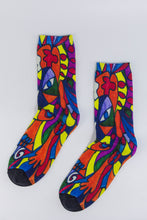 Load image into Gallery viewer, Custom Bamboo Sock with a stylistic face of a woman in green, red, blue, yellow, and orange.
