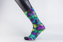 Load image into Gallery viewer, Abstract bamboo sock in purple, blue, yellow, and green geometrical designs. 
