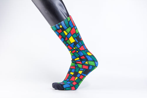 Checkered designed bamboo socks in a red, blue, green, and yellow rectangle and square mosaic.