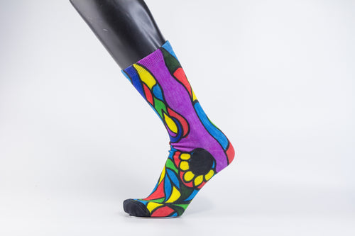 A stylistic bamboo sock with flowing whimsical designs in yellow, purple, blue, black, and red shapes.